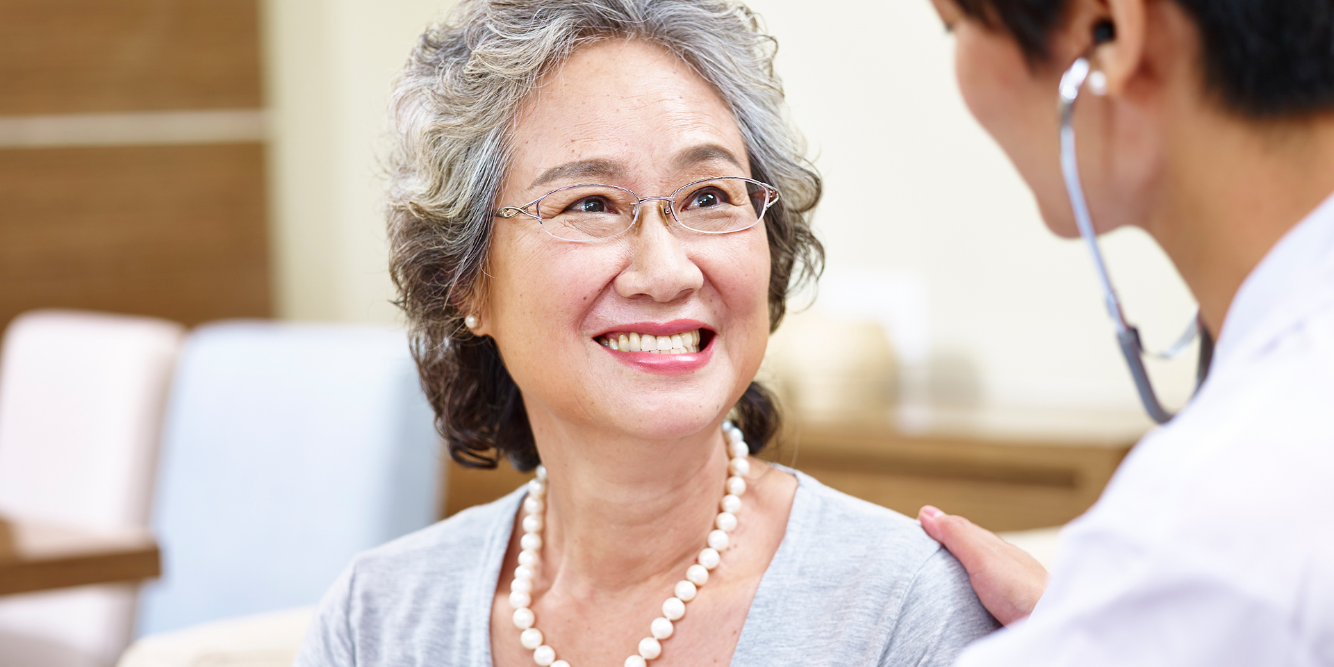 doctor talking to older patient