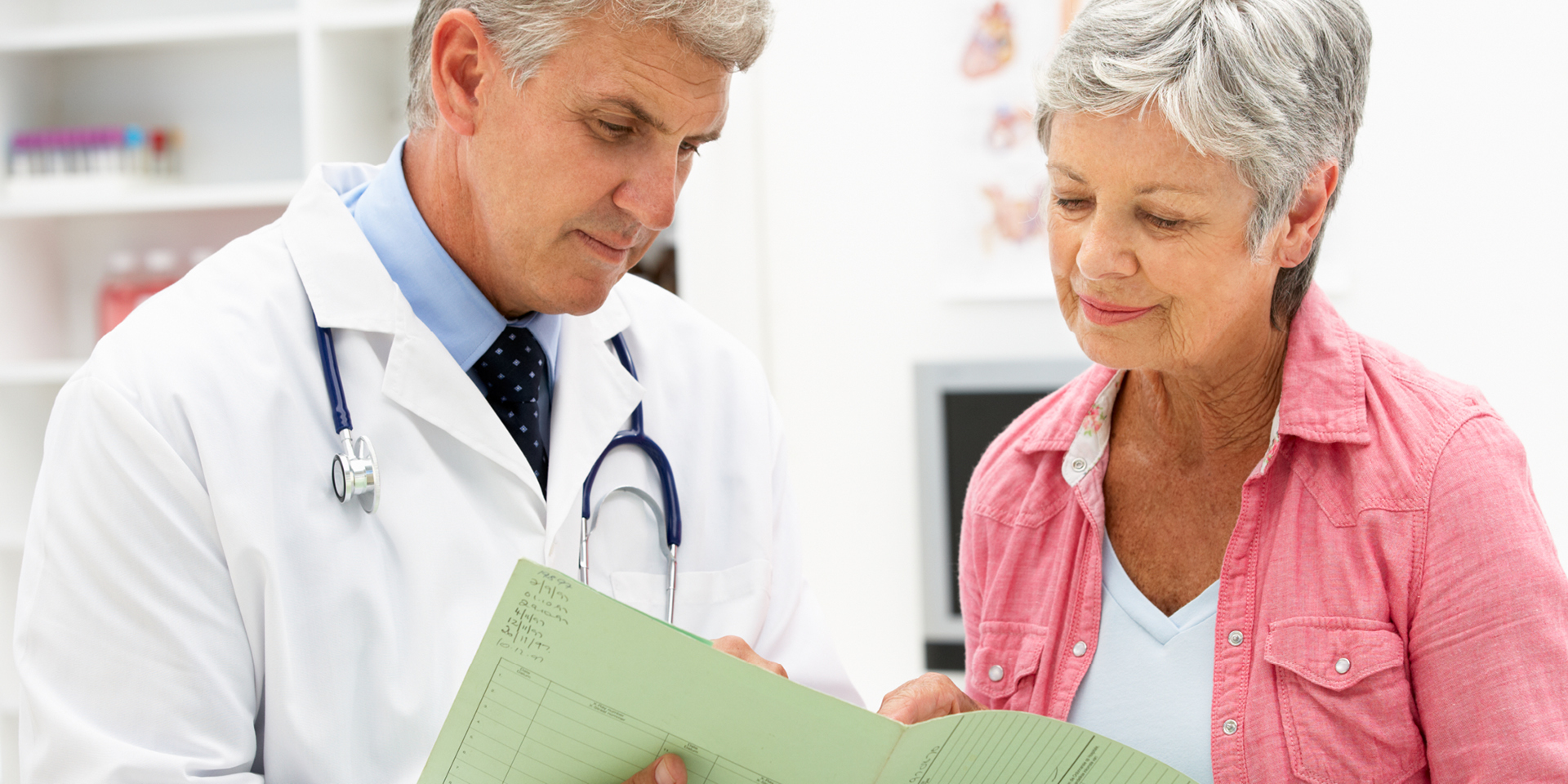 woman looking at information with her doctor