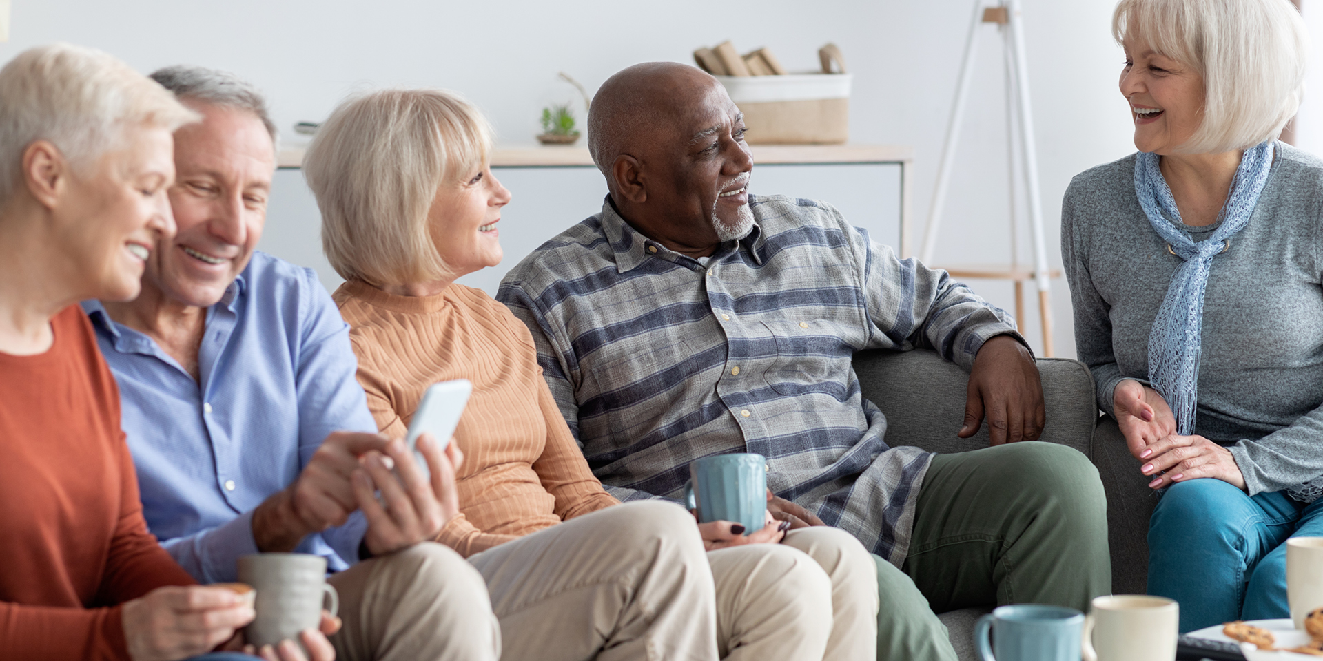 Group of senior citizens laughing and talking