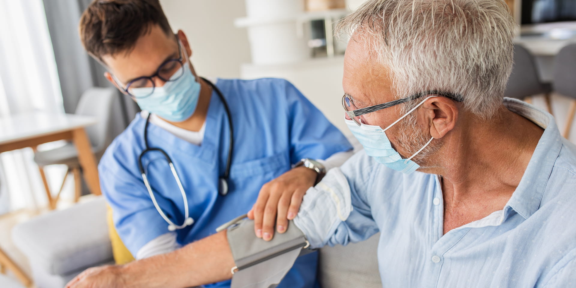 Provider is taking blood pressure measurements for a patient | Doylestown Health