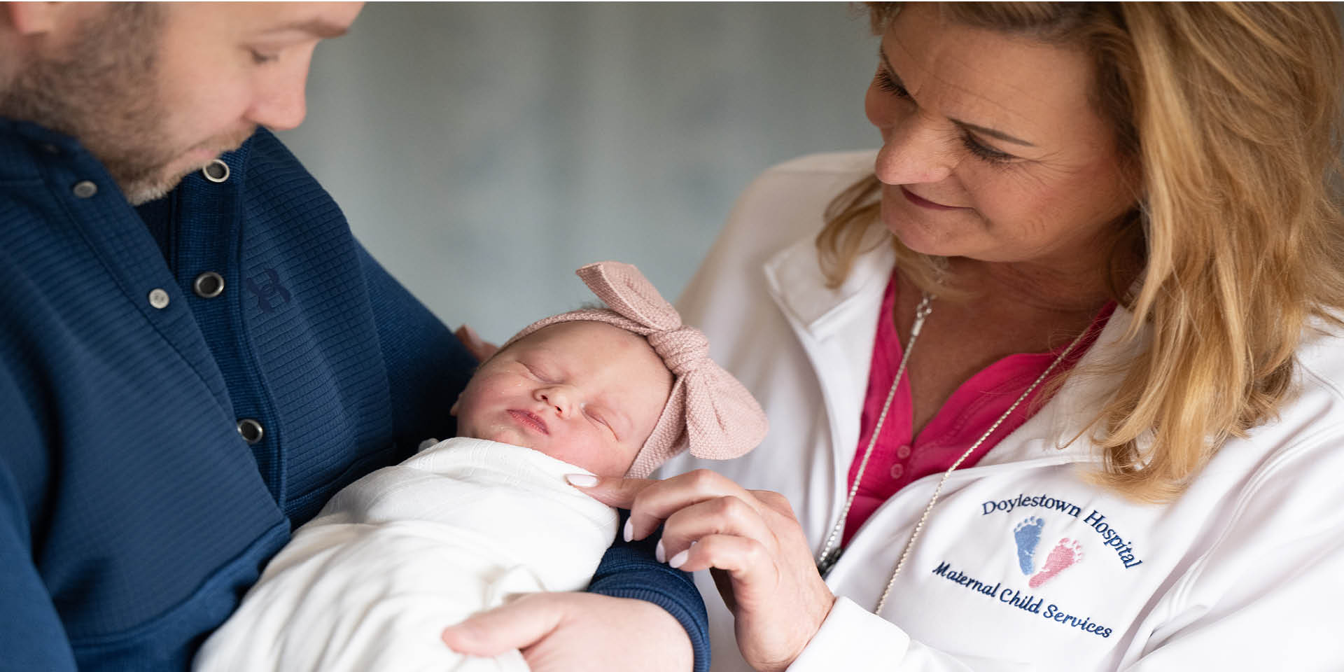 Father holding a baby and a nurse | Doylestown Health