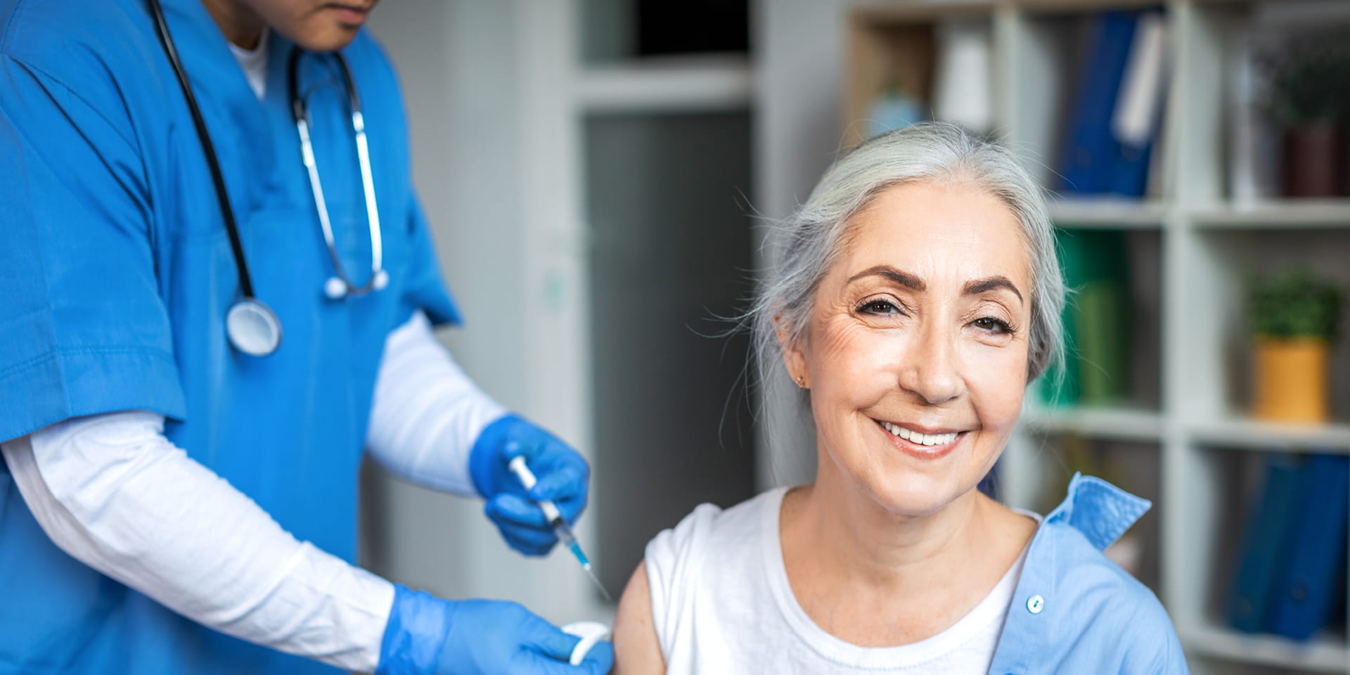 Provider giving a patient a measle vaccine | Doylestown Health