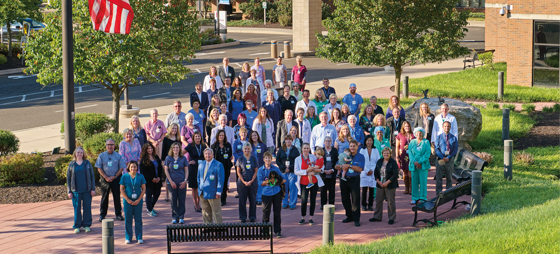 Employees posing in front of the Doylestown Hospital| Doylestown Health