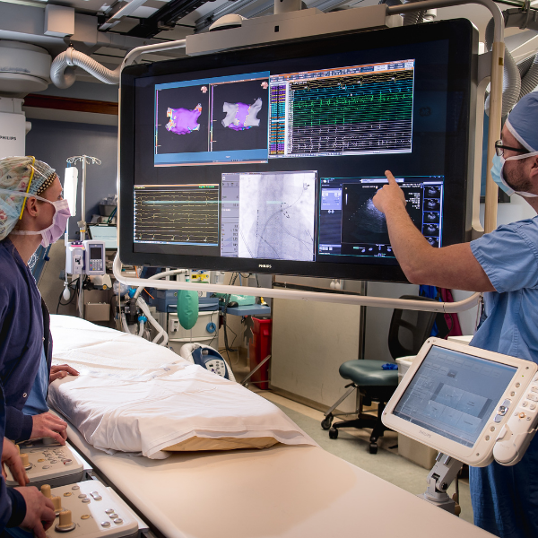 Providers inside an operating room discussing charts | Doylestown Health