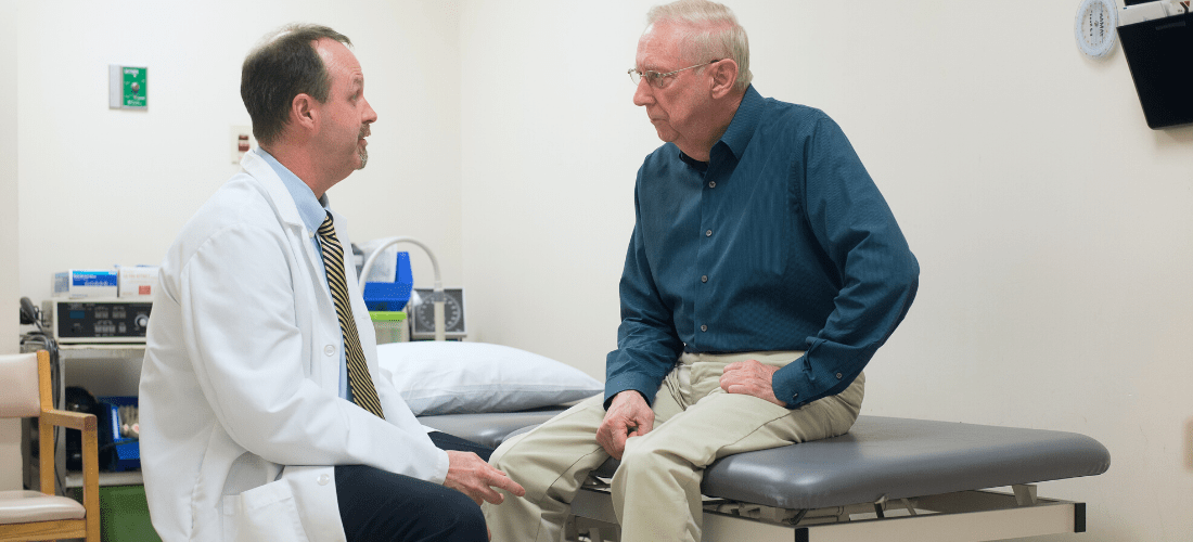 Doctor consulting with a Male patient| Doylestown Health