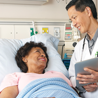 Provider discussing a chart with patient | Doylestown Health