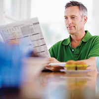Patient reading a newspaper | Doylestown Health